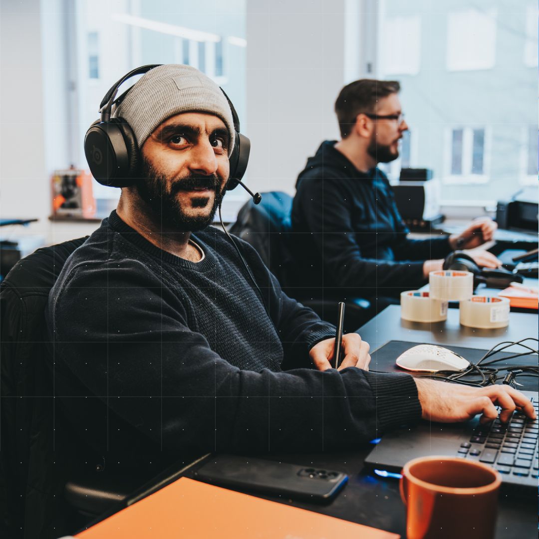 Game designers working in front of a computer